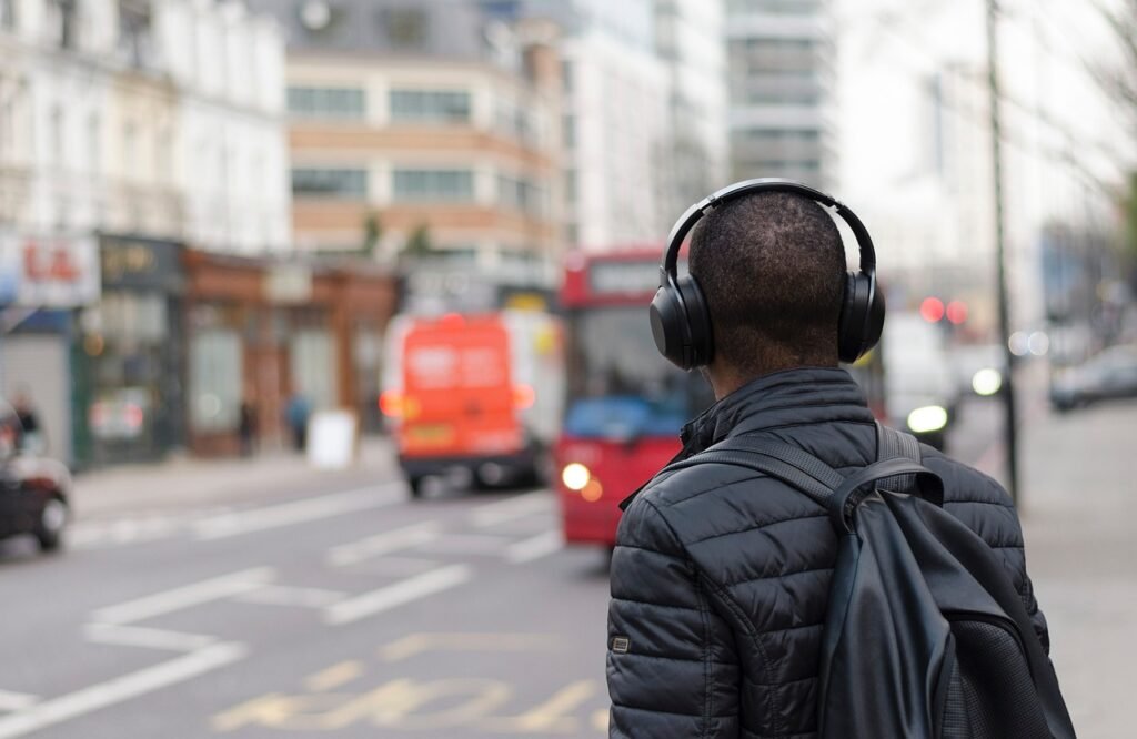 people, man, guy, travel, city, black, headphone, backpack, urban, buildings, blue, headphone, headphone, headphone, headphone, headphone, backpack